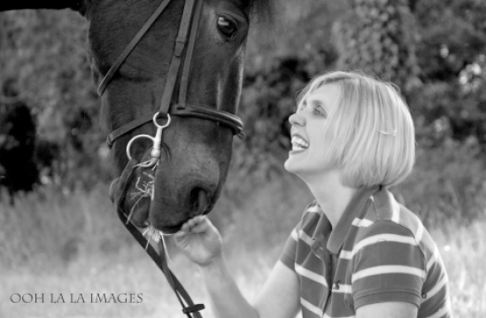 happy woman with her horse in black and white