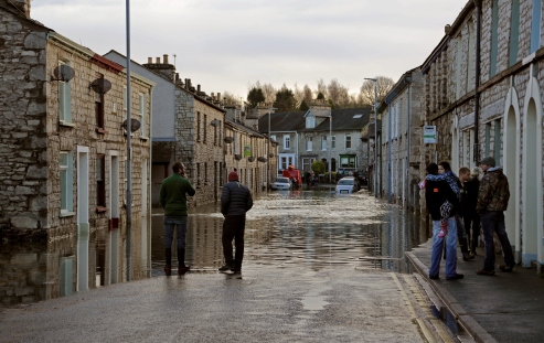 Flooded Kendal street and homeowners