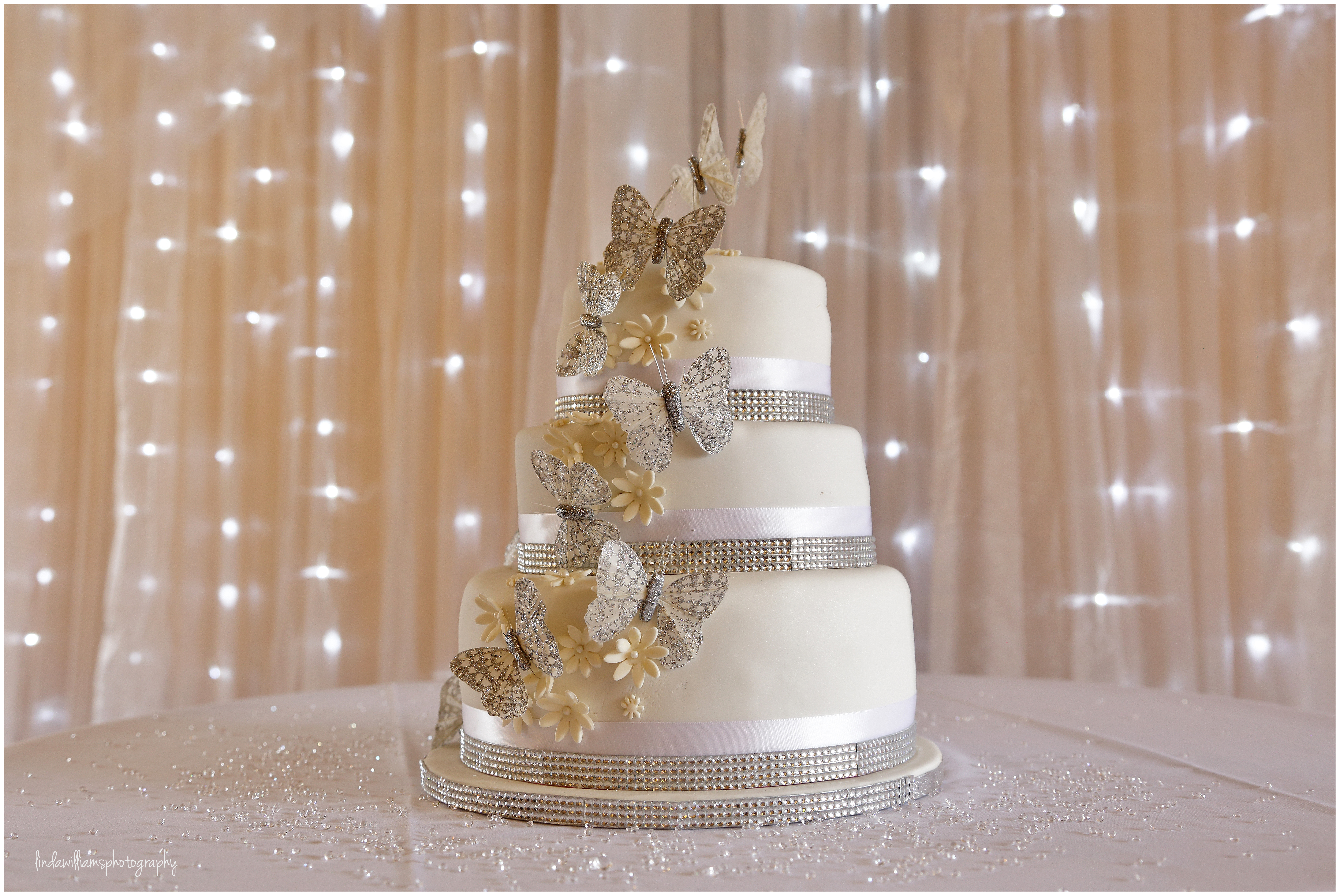 Wedding cake lit up by fairy lights