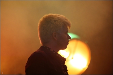 backlit photograph of musician on stage